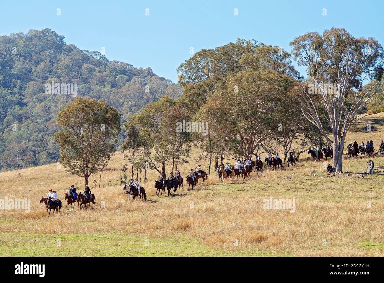 CORRYONG, VICTORIA, AUSTRALIA - APRIL 5TH 2019: The Man From Snowy River Bush Festival re-enactment, riders on horseback come down from out of the bus Stock Photo