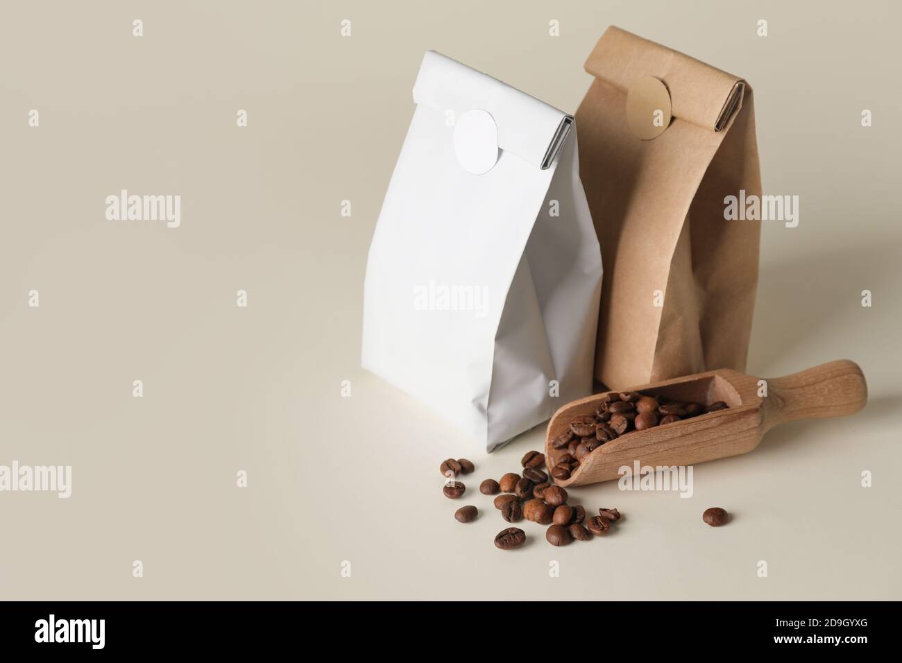 Blank coffee bags and scoop on light background Stock Photo Alamy