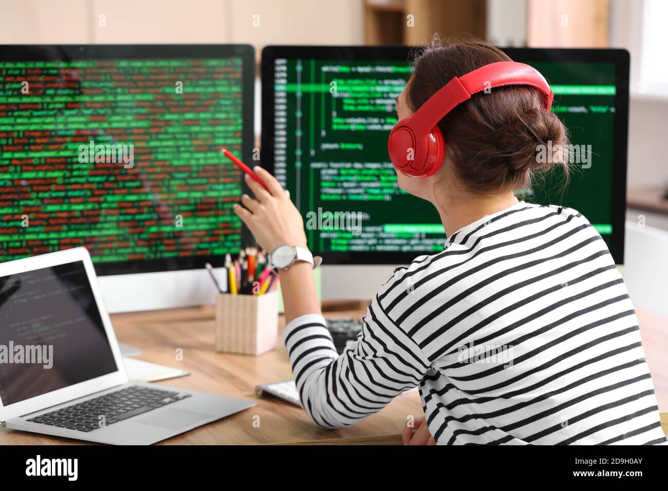 Female programmer working in office Stock Photo - Alamy