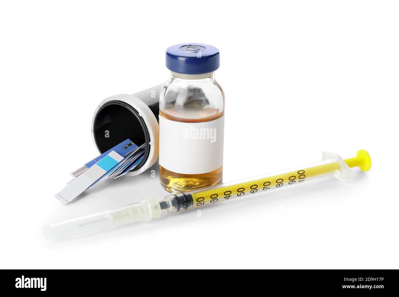 Test strips for bottle of insulin and syringe on white