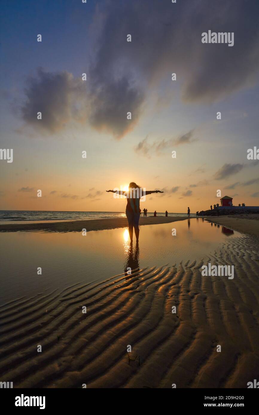 Silhouette of woman Standing In Beach Water Stock Photo - Alamy
