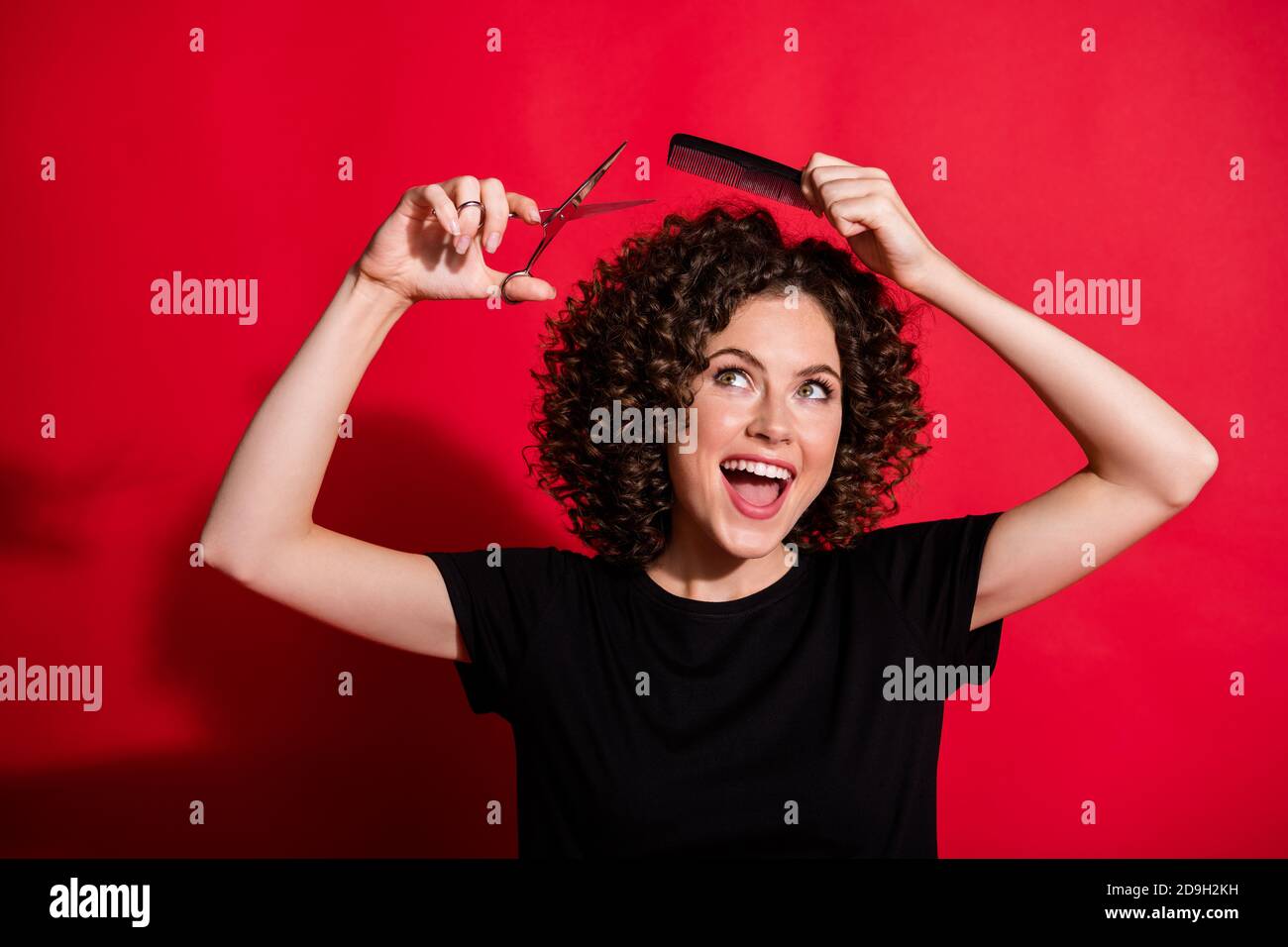 Portrait of toothy beautiful lady professional stylist hold scissors