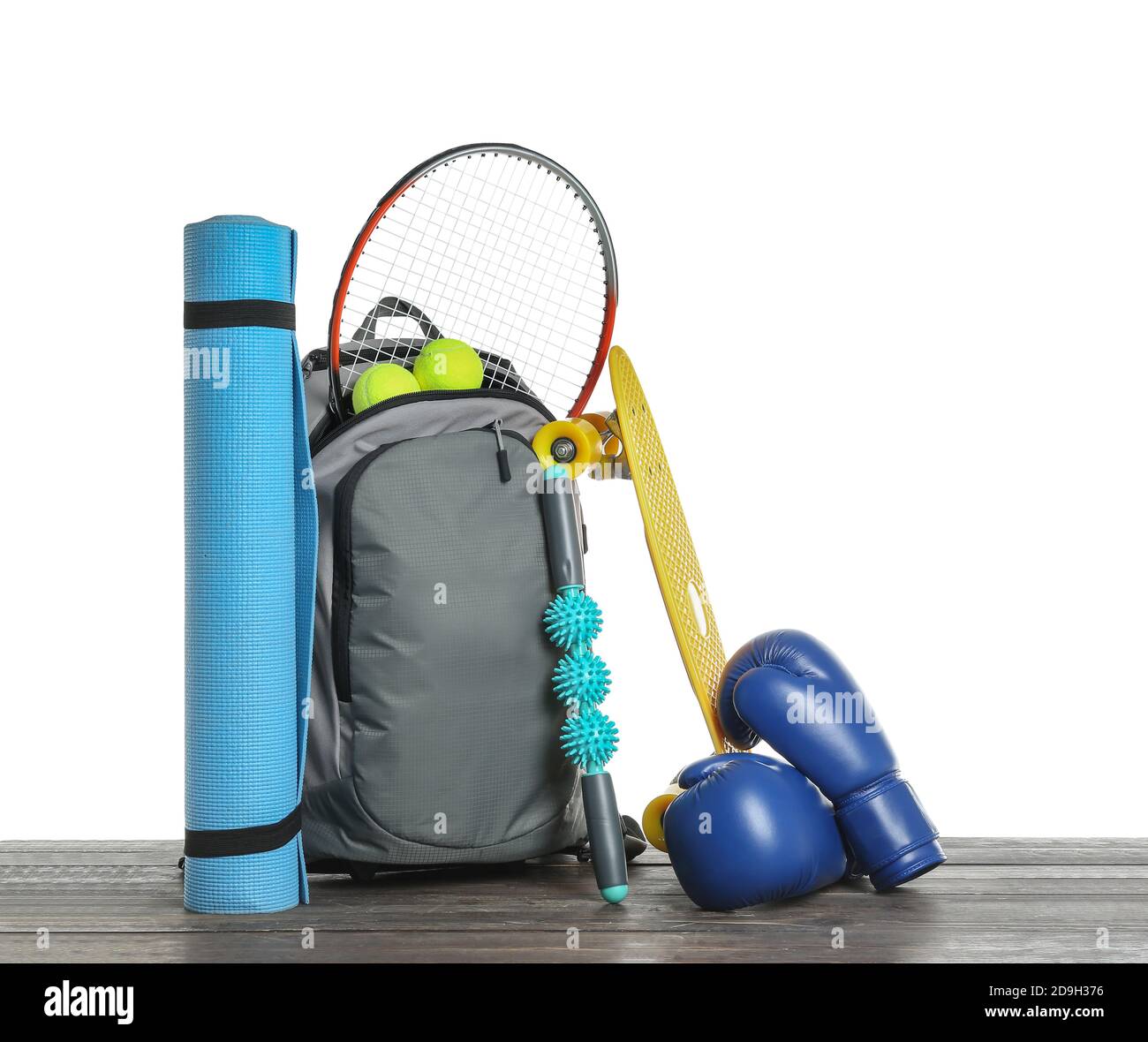 Set of sport equipment on table against white background Stock Photo ...