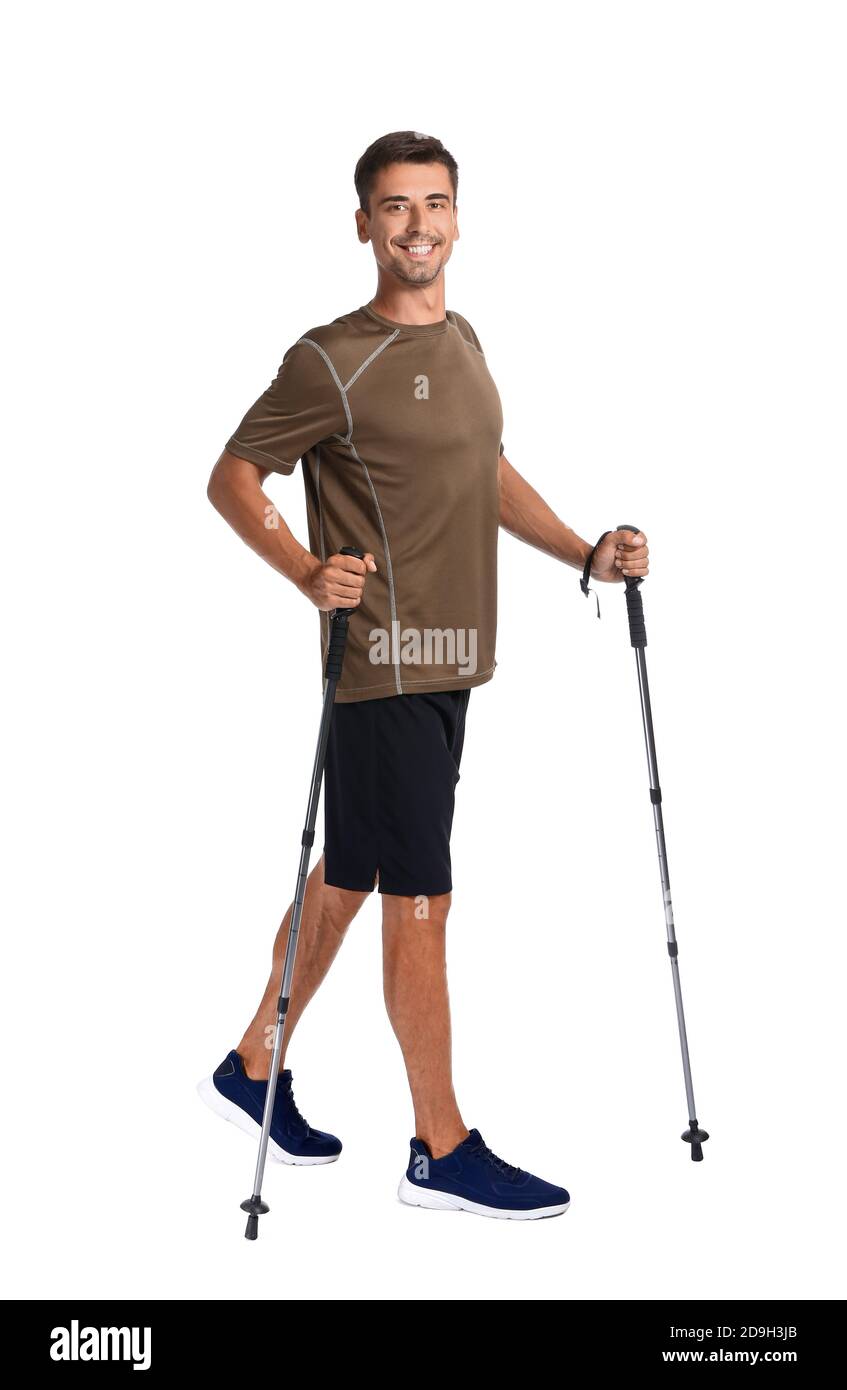 Young man with walking poles on white background Stock Photo