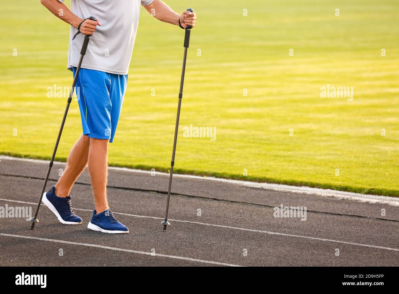 Man walking stadium hi-res stock photography and images - Alamy