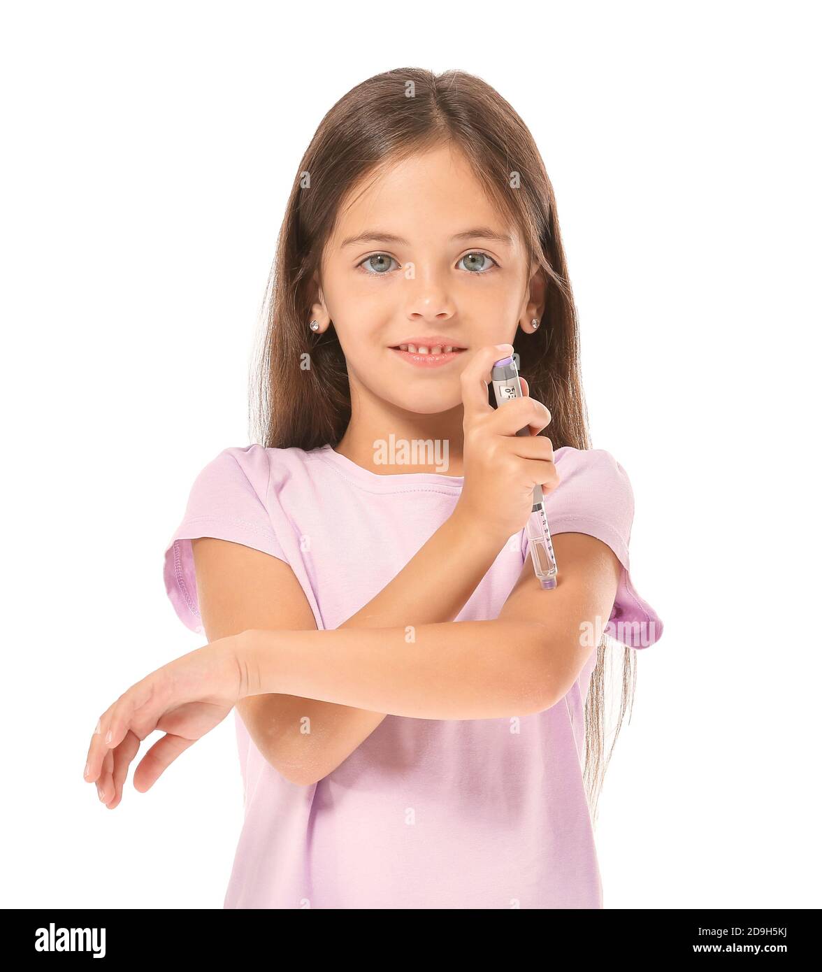 Little diabetic girl giving herself insulin injection on white