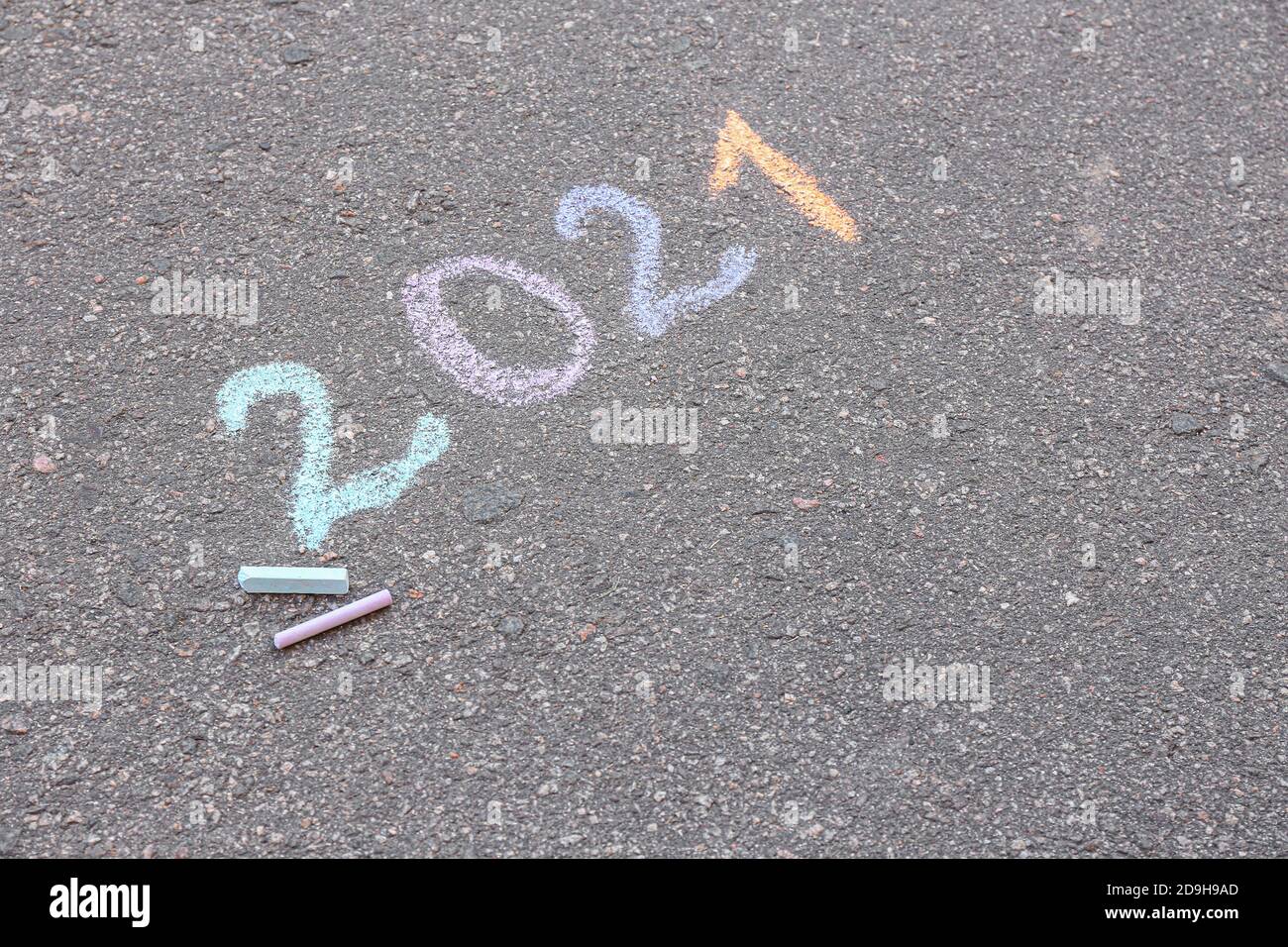 Figure 2021 written on asphalt outdoors Stock Photo