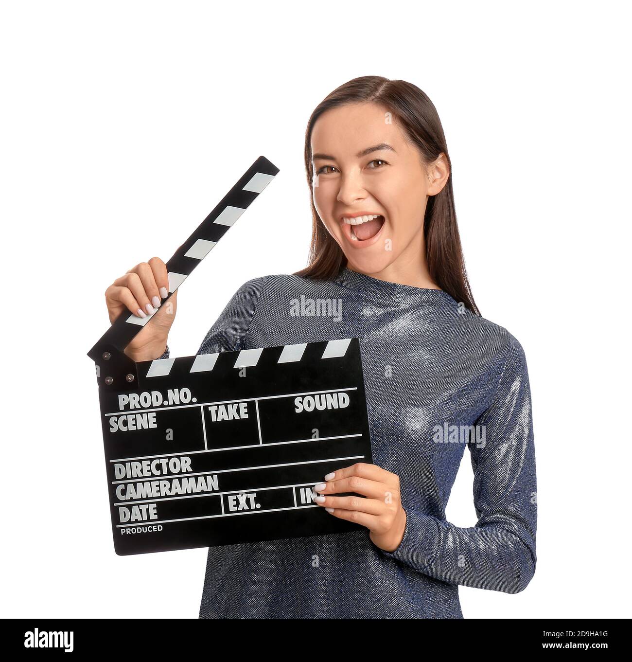 Young female film director with movie clapper on white background Stock