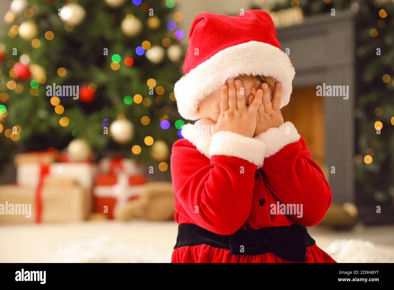 Cute little baby in Santa costume at home on Christmas eve Stock ...