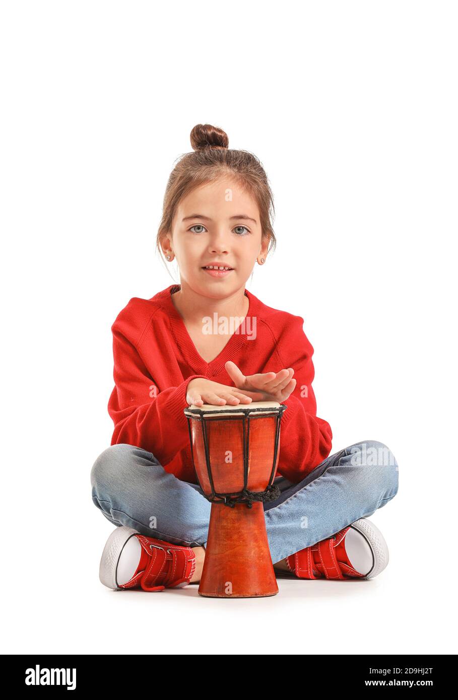 Little girl with drum on white background Stock Photo