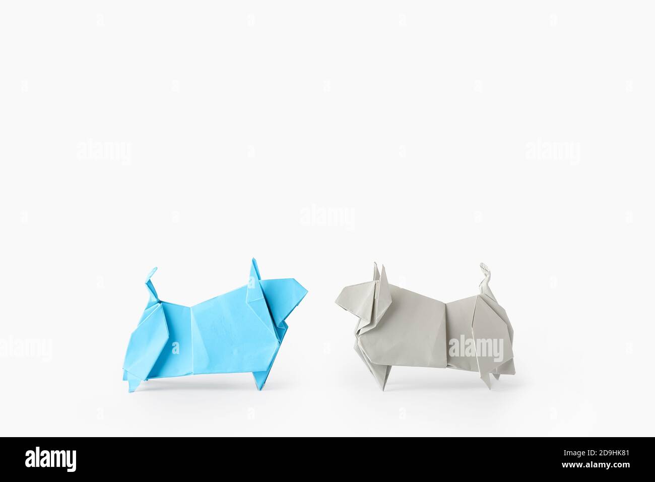 Origami bulls as symbol of year 2021 on white background Stock Photo