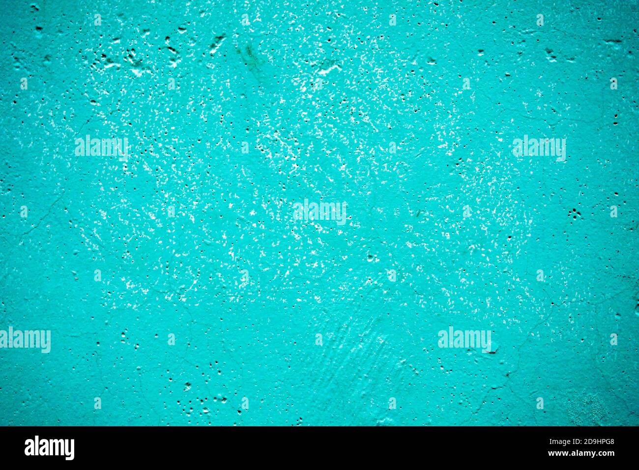 blue painted cement wall with dots and cracks, texture background Stock Photo