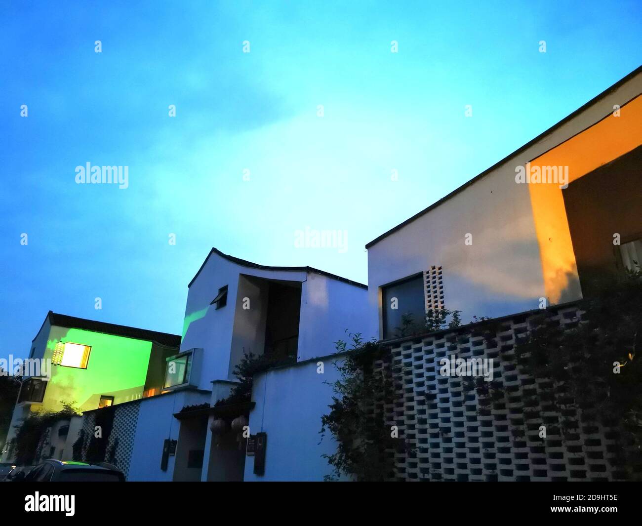 The exterior view of local farmers¯ houses which are combinations of tradition and modernity and stand in the light of streetlamps, in Dongziguan vill Stock Photo