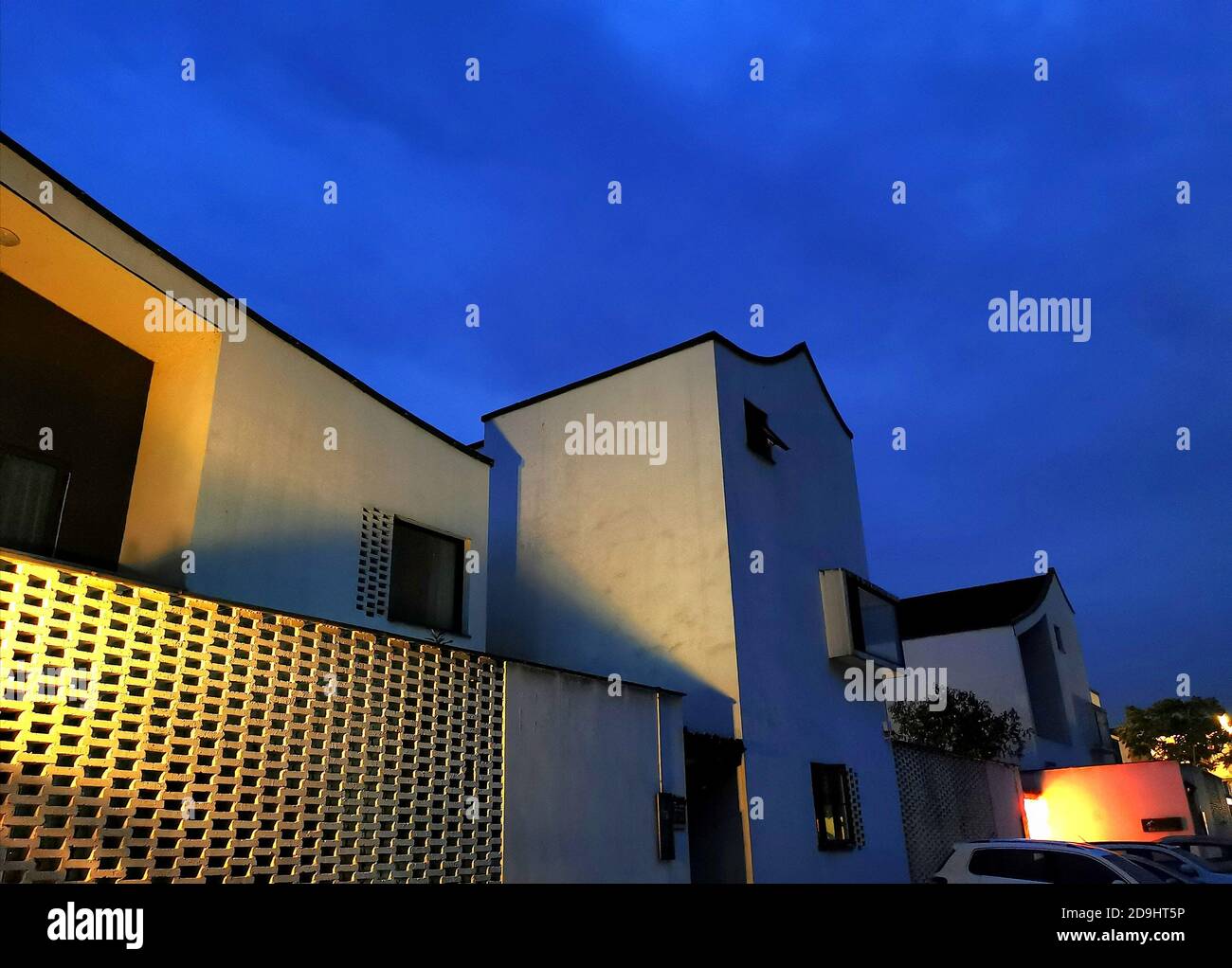 The exterior view of local farmers¯ houses which are combinations of tradition and modernity and stand in the light of streetlamps, in Dongziguan vill Stock Photo