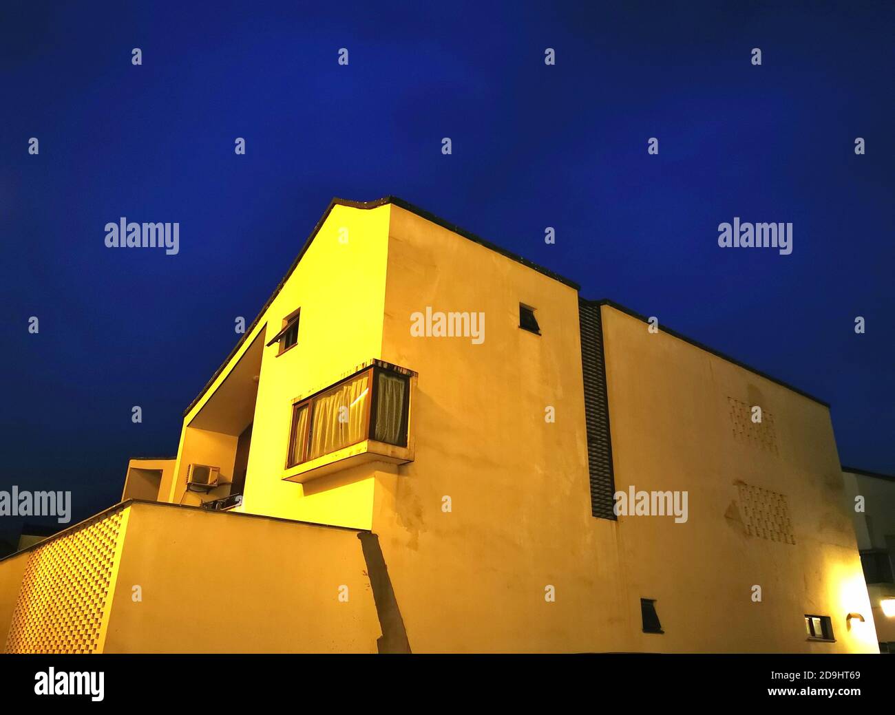 The exterior view of local farmers¯ houses which are combinations of tradition and modernity and stand in the light of streetlamps, in Dongziguan vill Stock Photo
