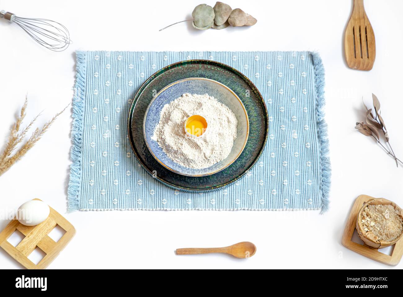 Composition with baking ingredients and kitchen accessories on a white background. Stock Photo