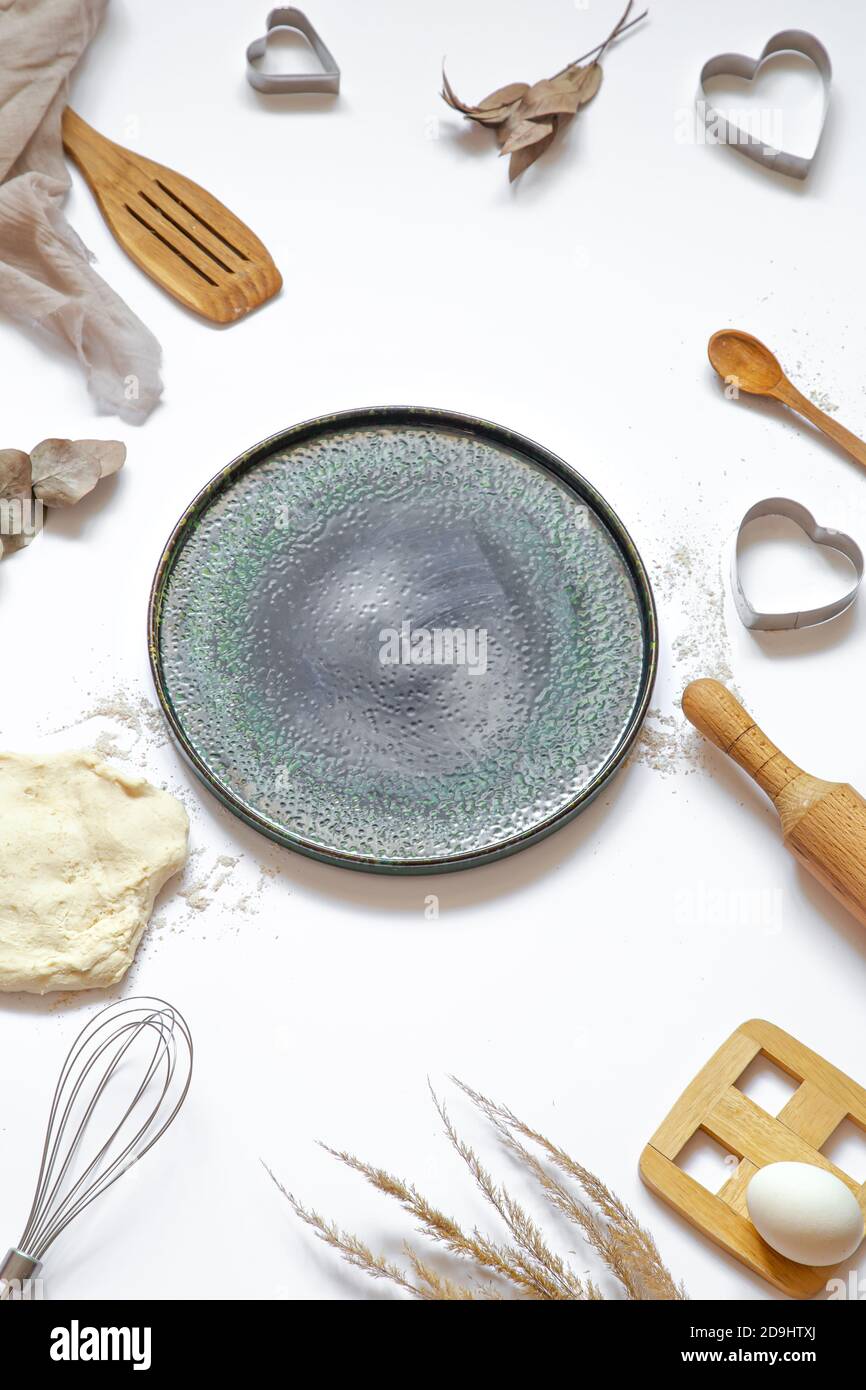 Composition with baking ingredients and kitchen accessories on a white background. Stock Photo