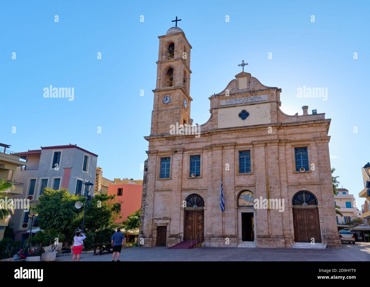 Church and Greek Orthodox cathedral of presentation of Virgin Mary in Chania, Crete, Greece in early morning. Unrecognizable tourist take pictures Stock Photo