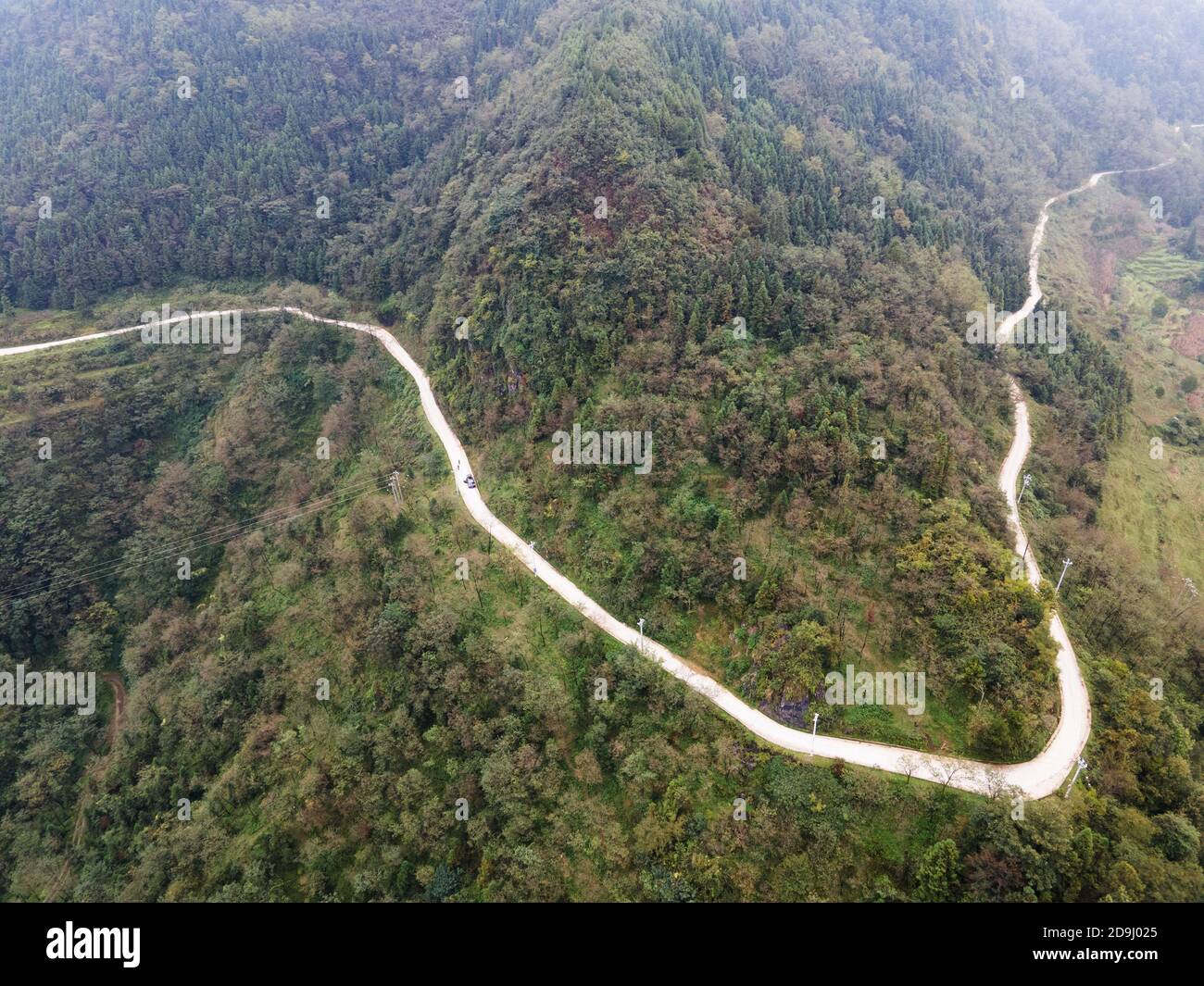 An aerial view of mountain roads, which are great complement of expressways, zigzagging and connecting mountain villages scattering in the mountainous Stock Photo