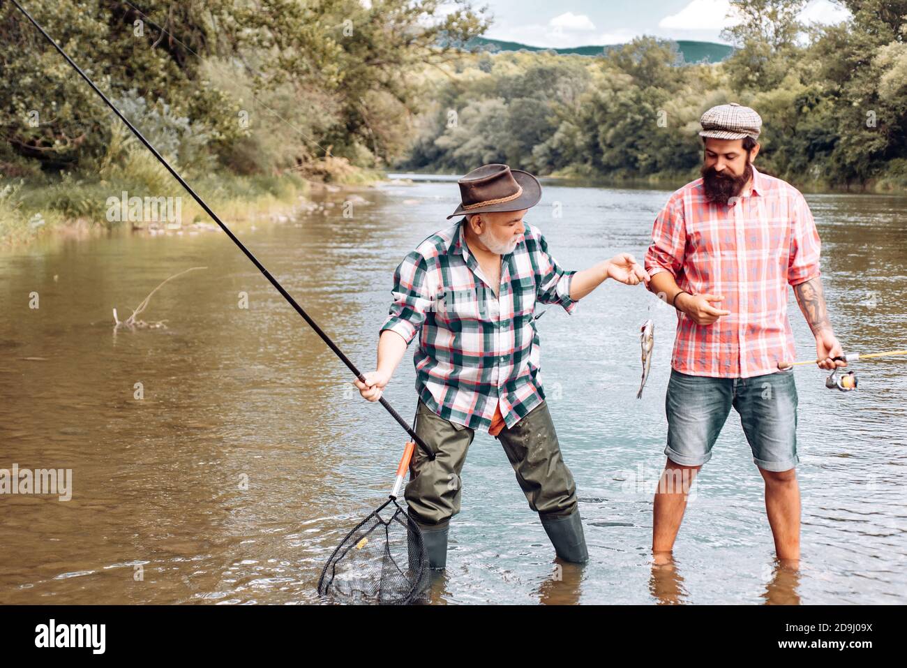 One Man Caught a Fish with a Fishing Rod. Stock Photo - Image of activity,  grandpa: 296462866