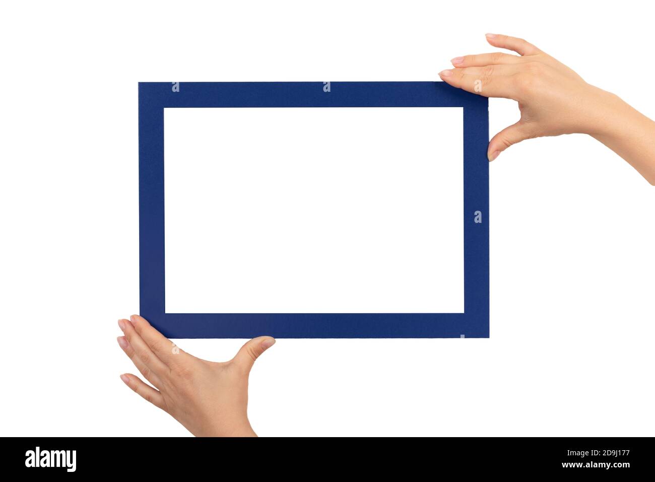 female hands holding mockup frames isolated on white background. Certificate, diploma, picture, gratitude white frame mockup. blue color frame Stock Photo
