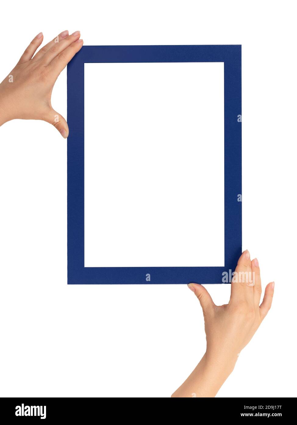 female hands holding mockup frames isolated on white background. Certificate, diploma, picture, gratitude white frame mockup. blue color frame. vertic Stock Photo