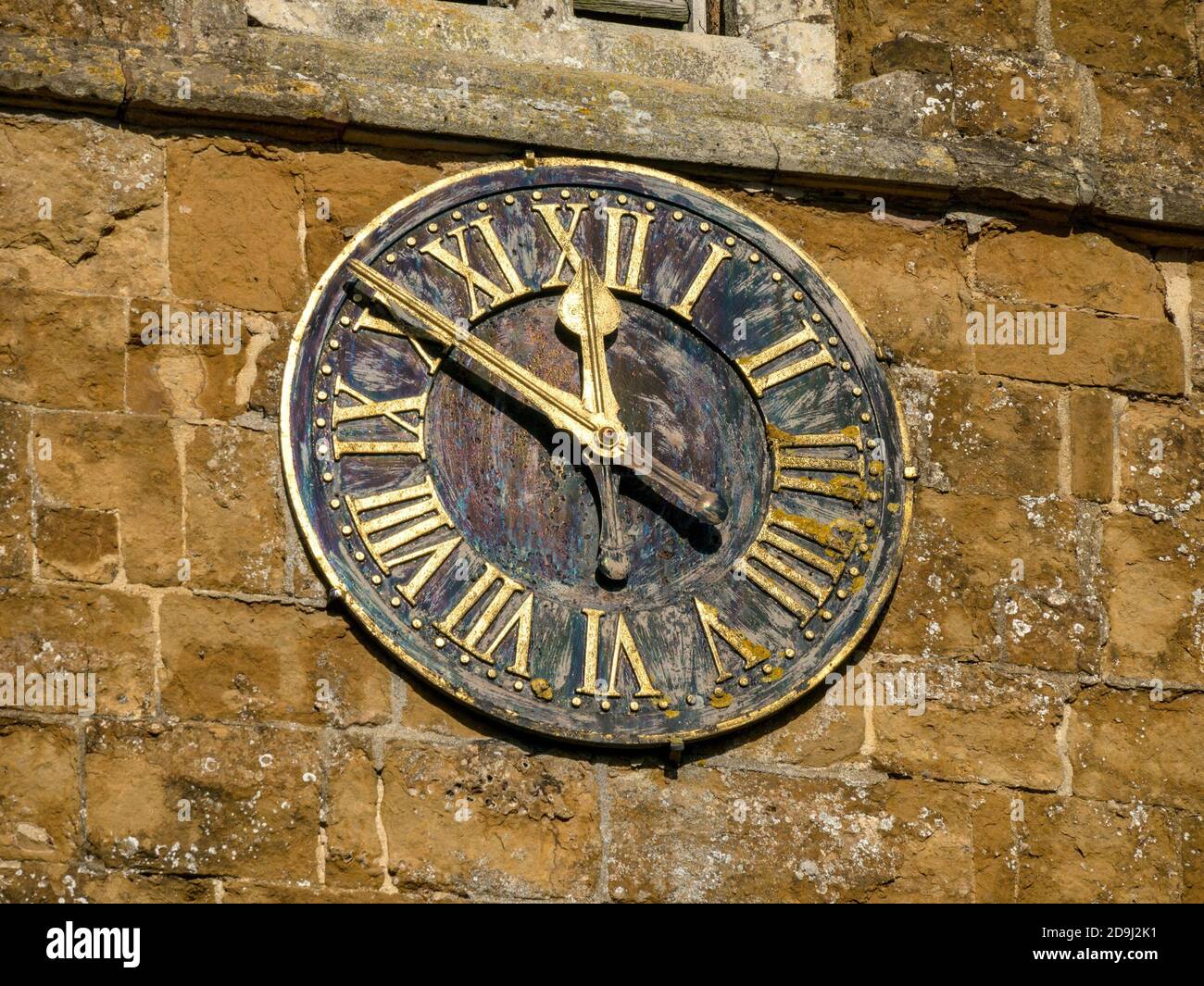 Church clock, St. Peter's Church in the village of Knossington, Leicestershire, England, UK Stock Photo