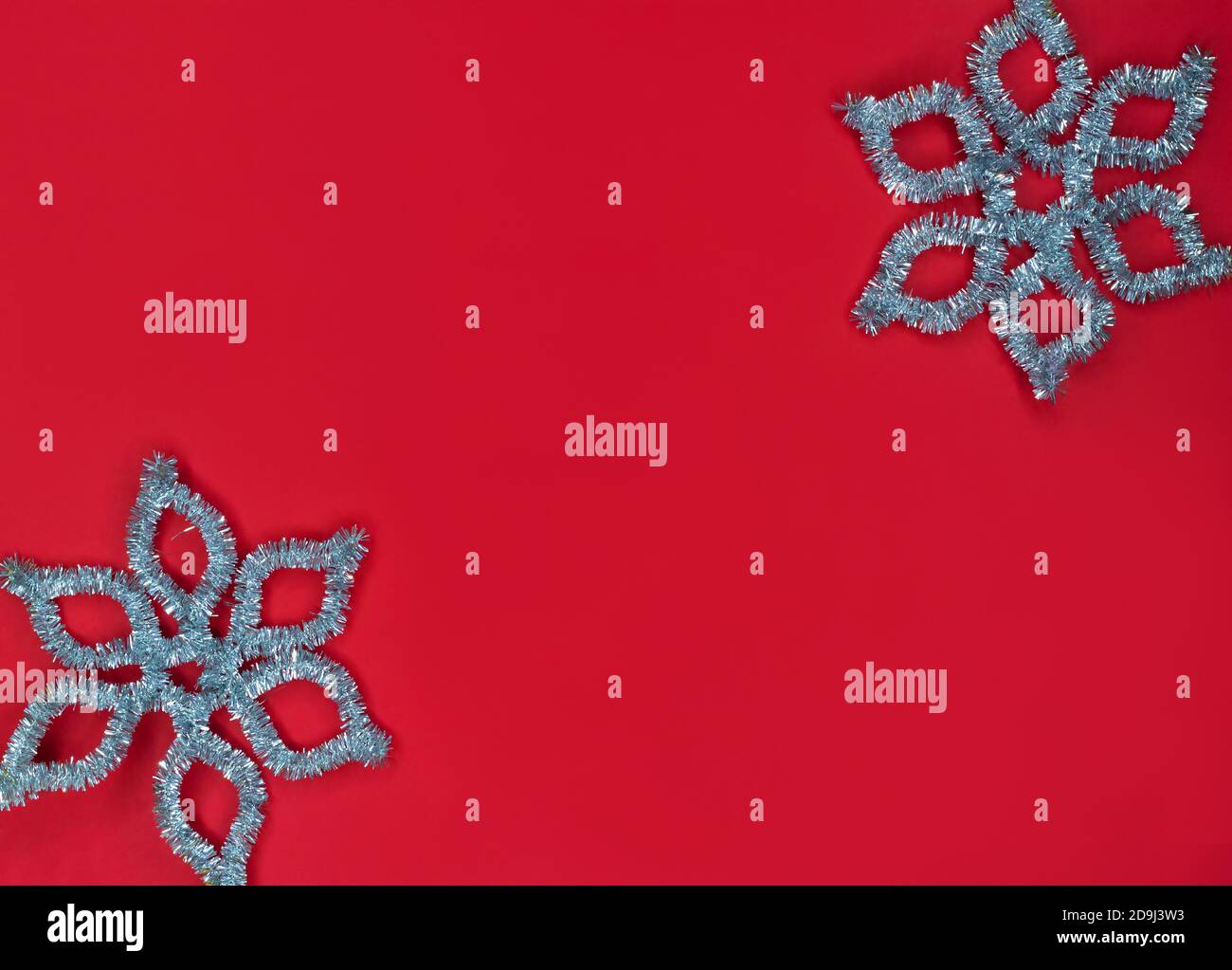 Christmas background in red with silver snowflakes. Stock Photo