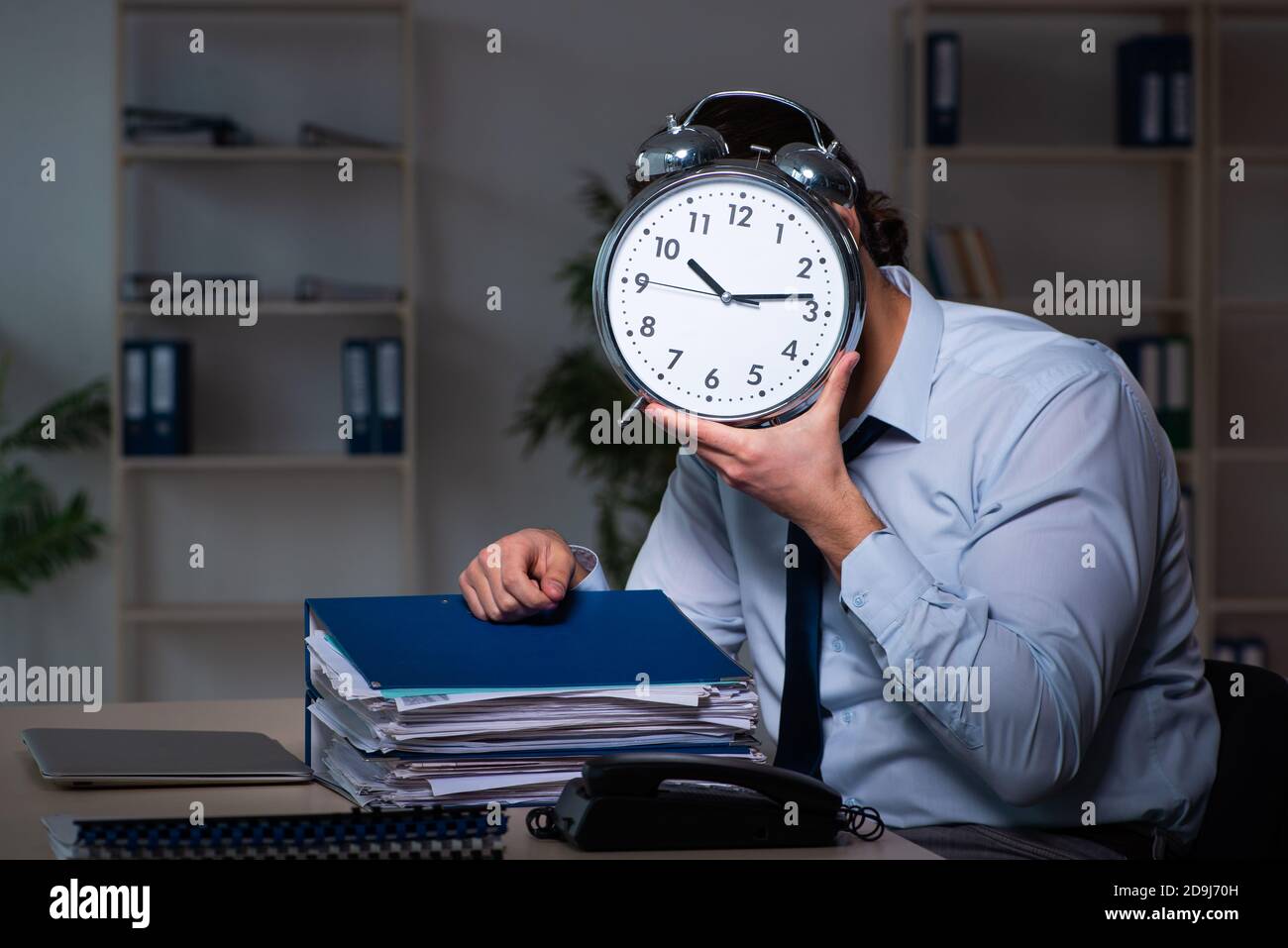 Young businessman working late in the office workplace Stock Photo - Alamy