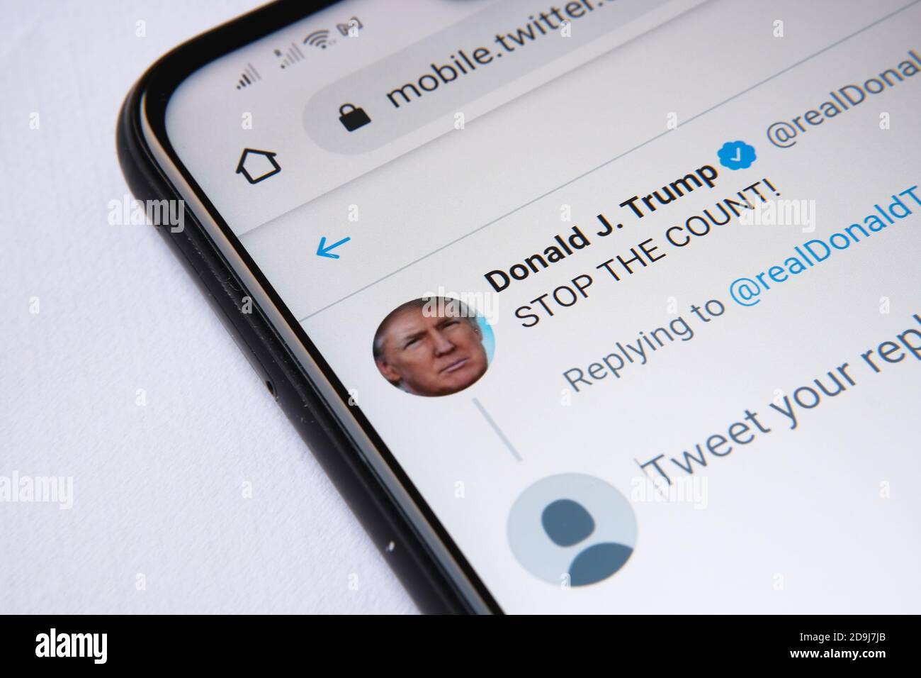 Donald Trump's twitter page with the post 'STOP THE COUNT' seen on the smartphone screen. Stock Photo
