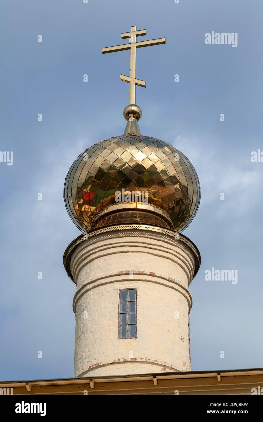 Golden cupola with cross of Tikhvin Cathedral of Dormition. Russia Stock Photo