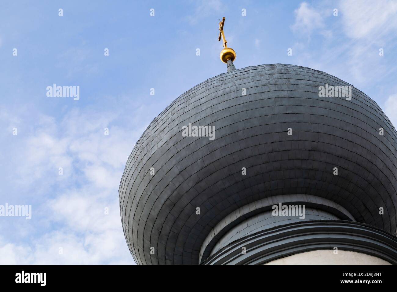 Cupola with golden cross of Tikhvin Cathedral of Dormition Stock Photo