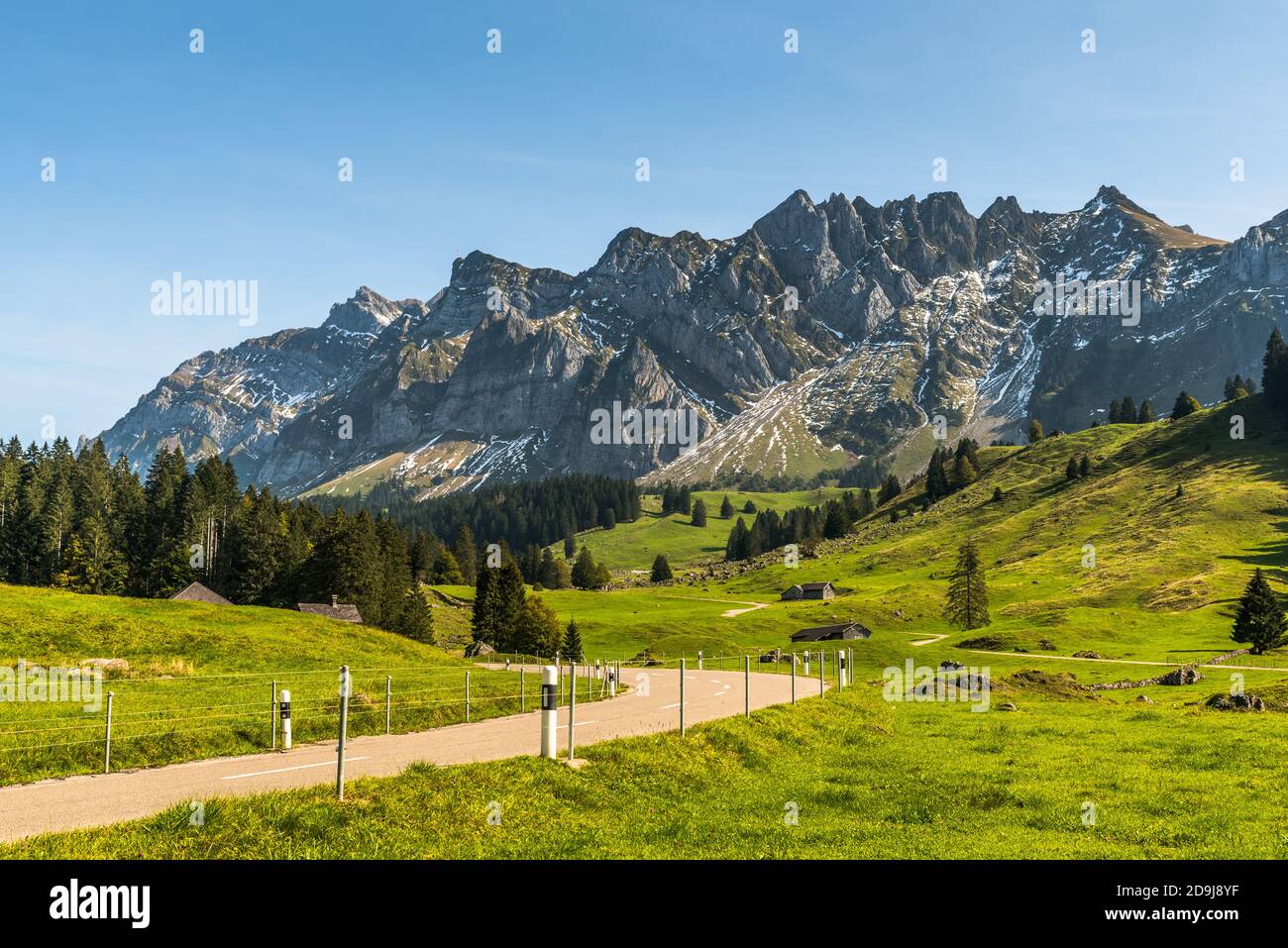Mountain road in the Swiss Alps with view of  the Alpstein and Mt. Saentis, Toggenburg, Canton St. Gallen, Switzerland Stock Photo