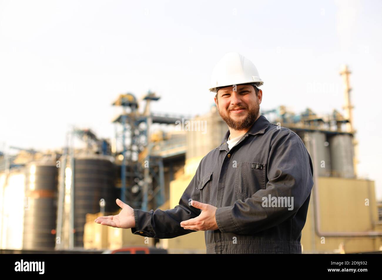 Portrait of industrial worker and engineer showing factory exterior ...