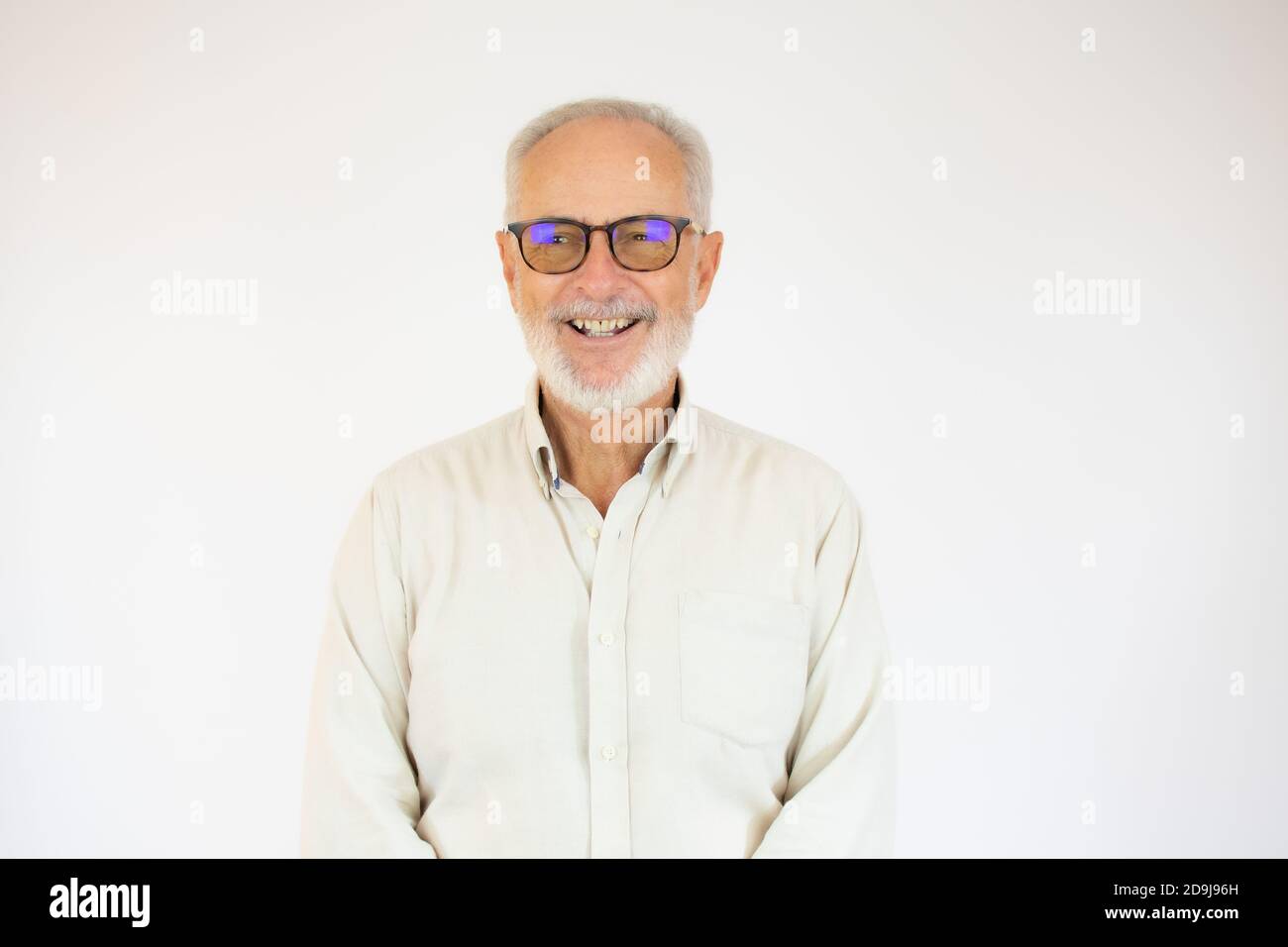 Portrait of cheerful senior man who is looking at camera and smiling ...
