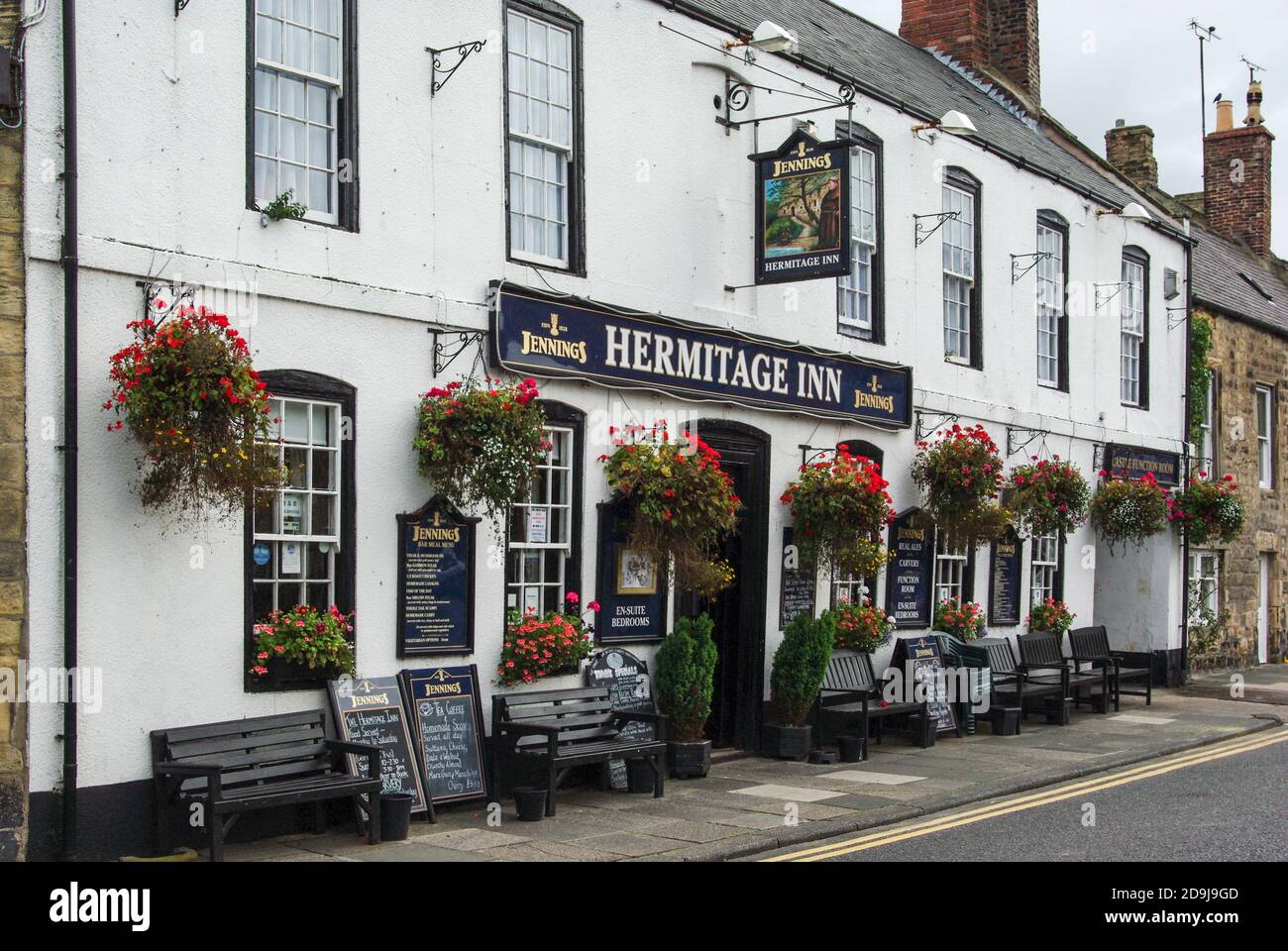 Frontage of the Hermitage Inn, Warkworth, Northumberland, UK; 18th century pub offering drinks, food and accommodation. Stock Photo