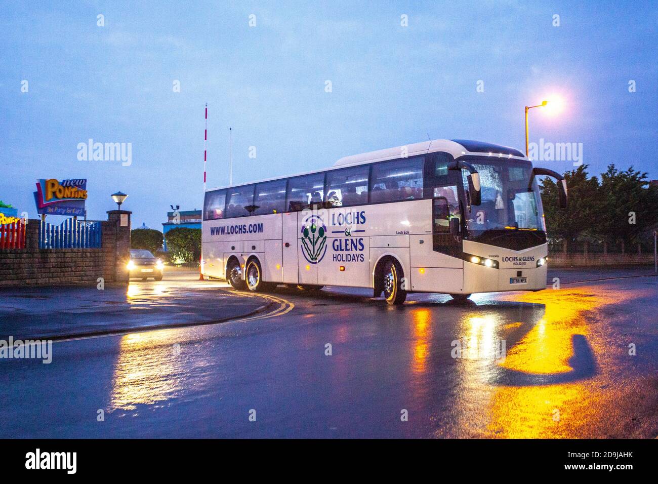 Southport, Merseyside. UK Weather. 6th November, 2020.  Dawn breaks over Pontins Holiday Camp in Ainsdale as Army medical Corp soldiers embark on civilian coaches en-route to Liverpool, for the UKs first mass city centre screening for Covid 19.  The city-wide testing operation will begin in Liverpool from today, with 2,000 military personnel setting up as many as 85 new testing stations in a bid to offer everyone in the city regular testing.  Credit; MediaWorldImages/AlamyLiveNews Stock Photo