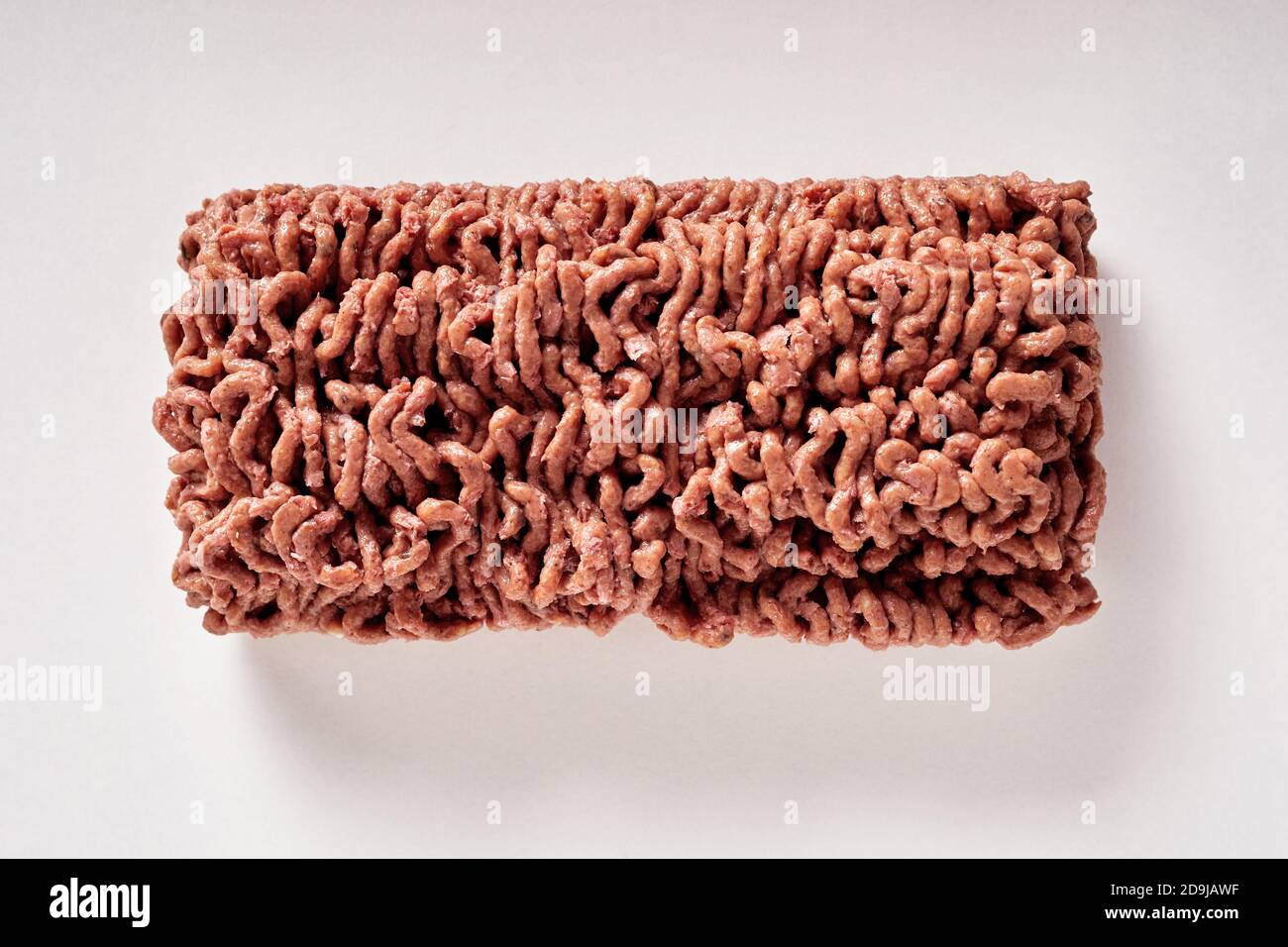 Black of raw plant based minced vegan meat substitute on a white