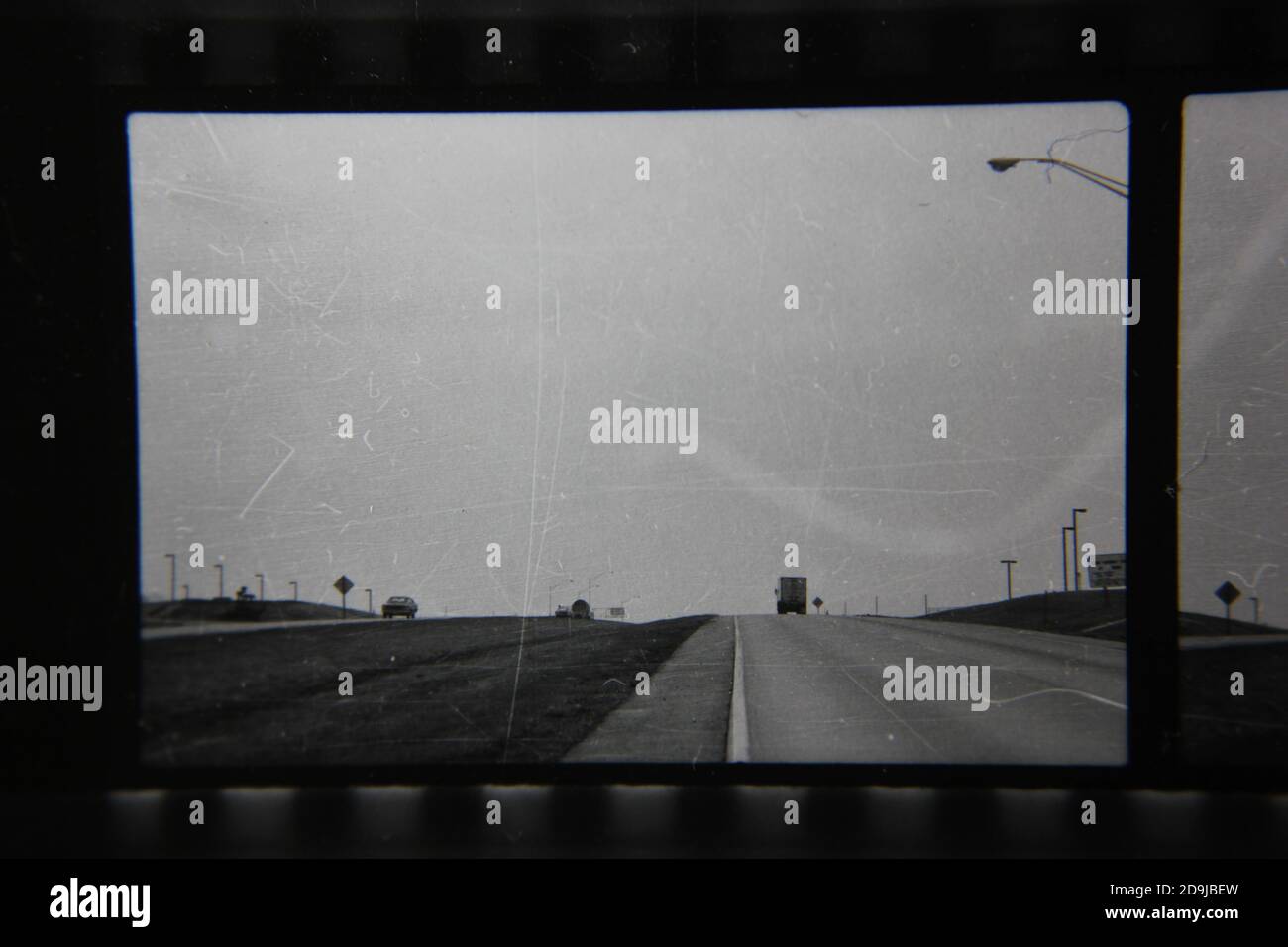 Fine 1970s vintage black and white photography on the road on a drive in the country. Stock Photo