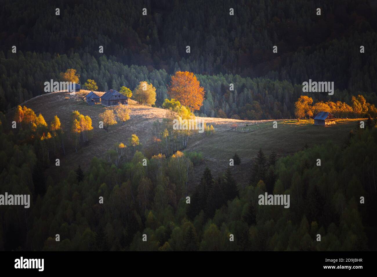 Autumn rural scene of the Romanian village in Transylvania, at the foot ...