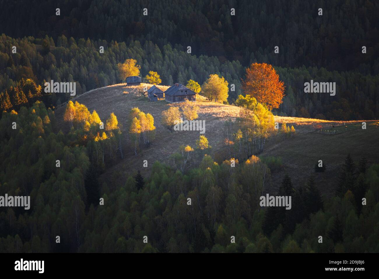 Autumn rural scene of the Romanian village in Transylvania, at the foot ...