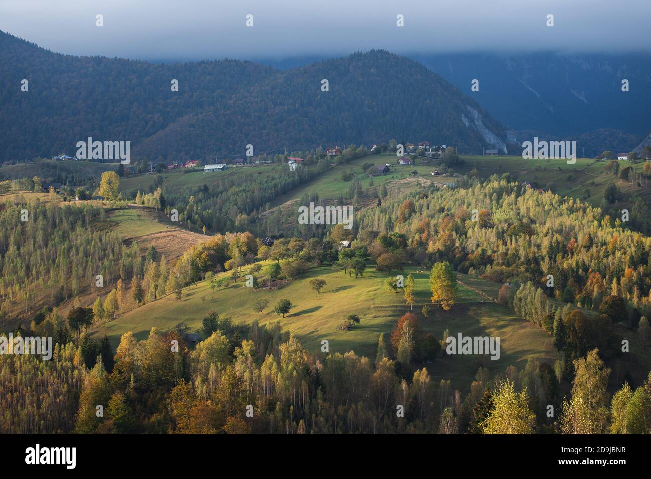 Autumn rural scene of the Romanian village in Transylvania, at the foot ...