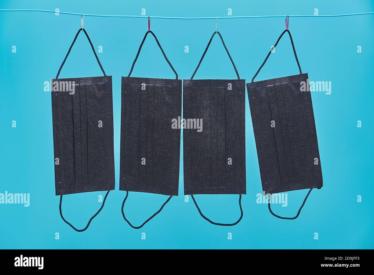 Four black medical masks hi-res stock photography and images - Alamy