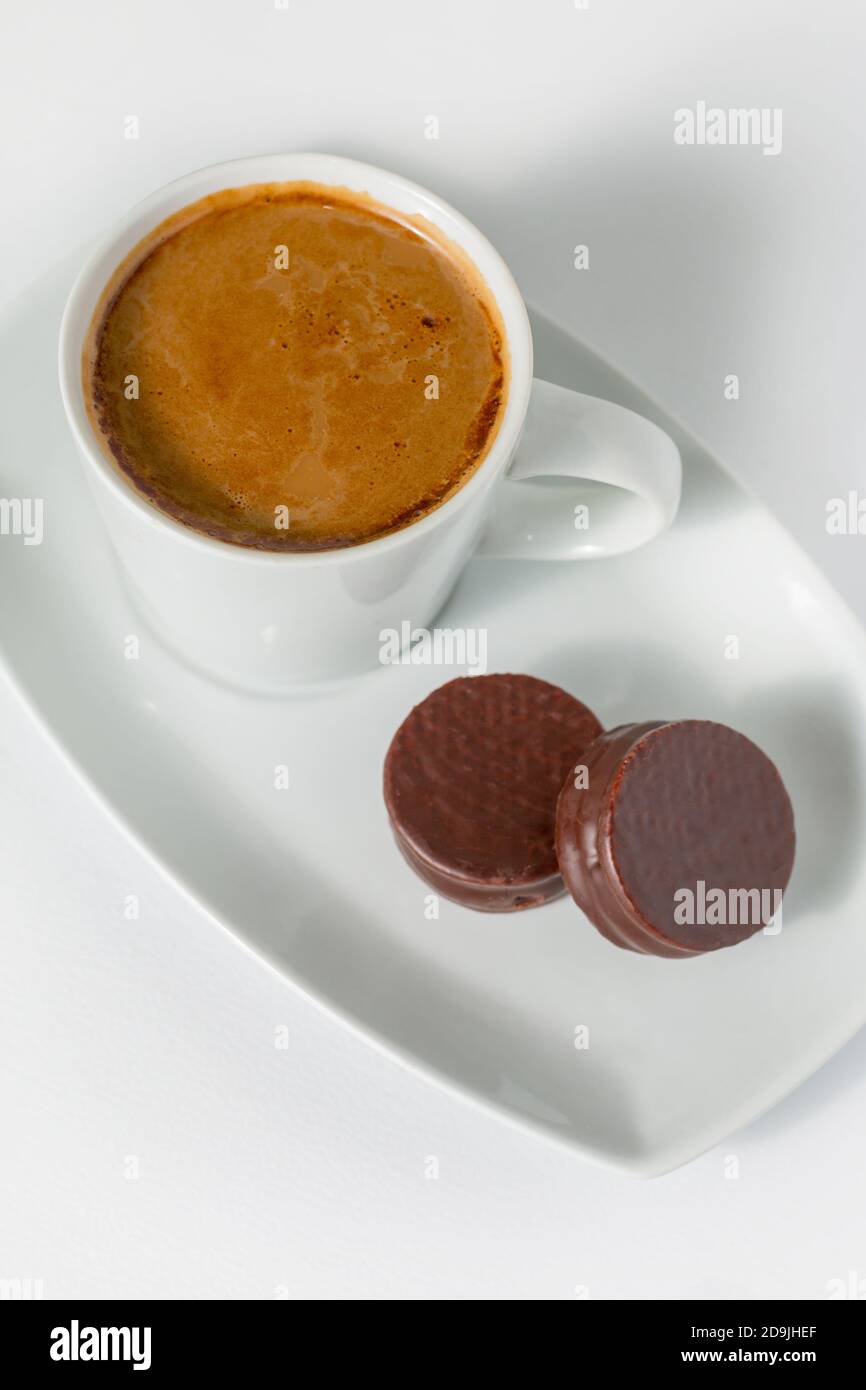 Cup of coffee and chocolate cookies isolated on a white background Stock Photo