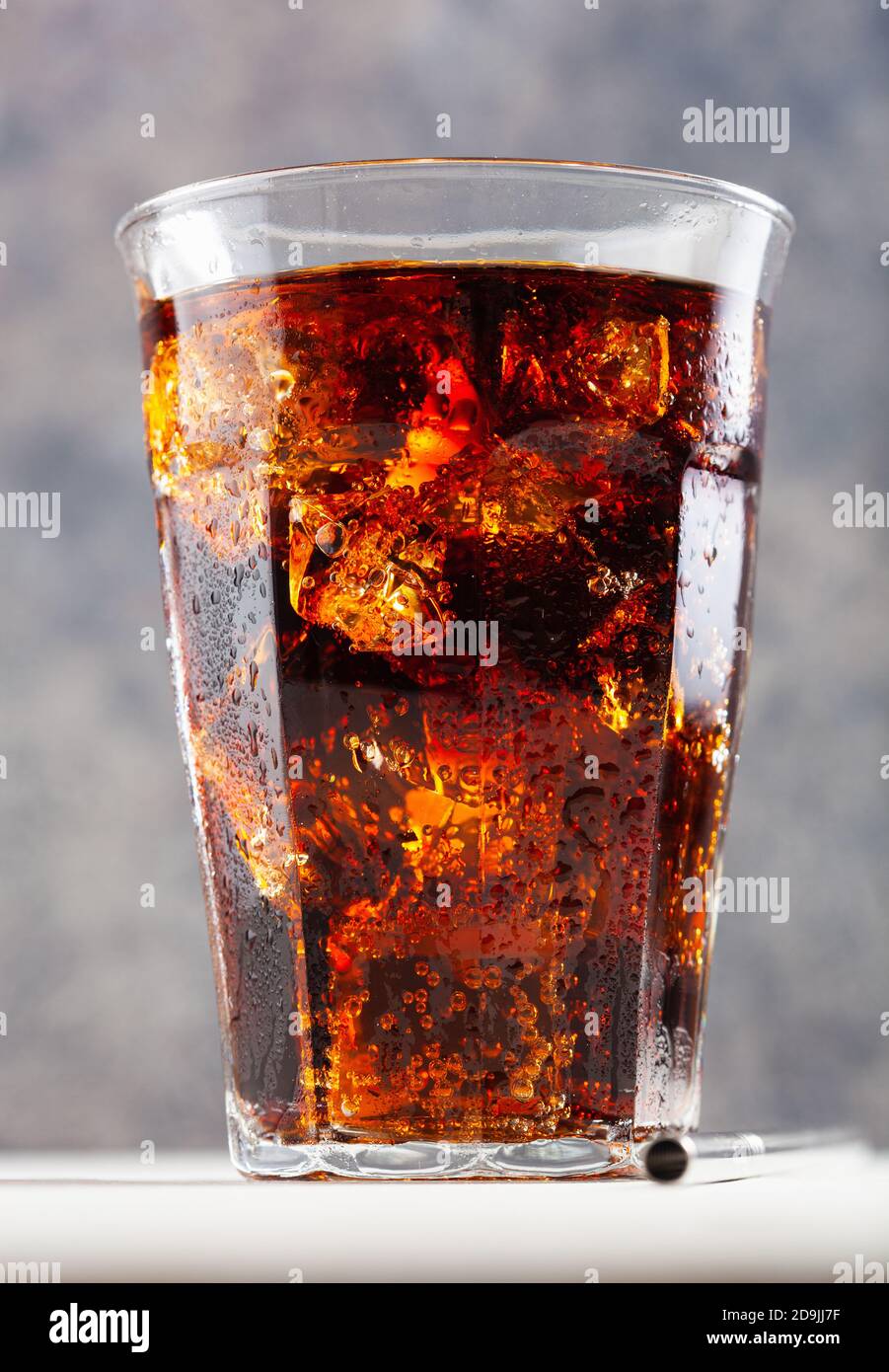 glass of cold cola soft drink with ice on concrete background Stock ...