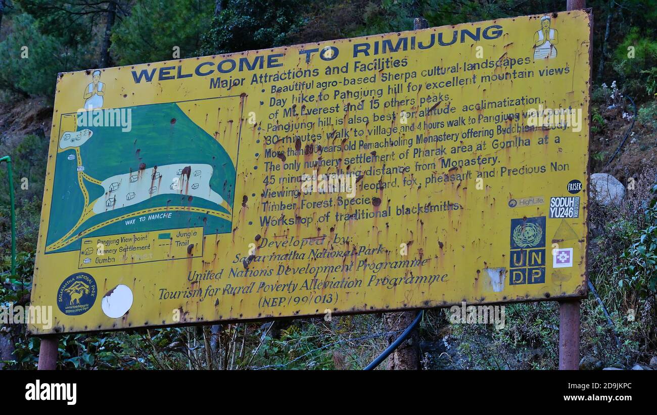 Rimijung, Nepal - 11/12/2019: Old rusty sign erected by the United Nations Development Programme (UNDP) in Sagarmatha National Park. Stock Photo