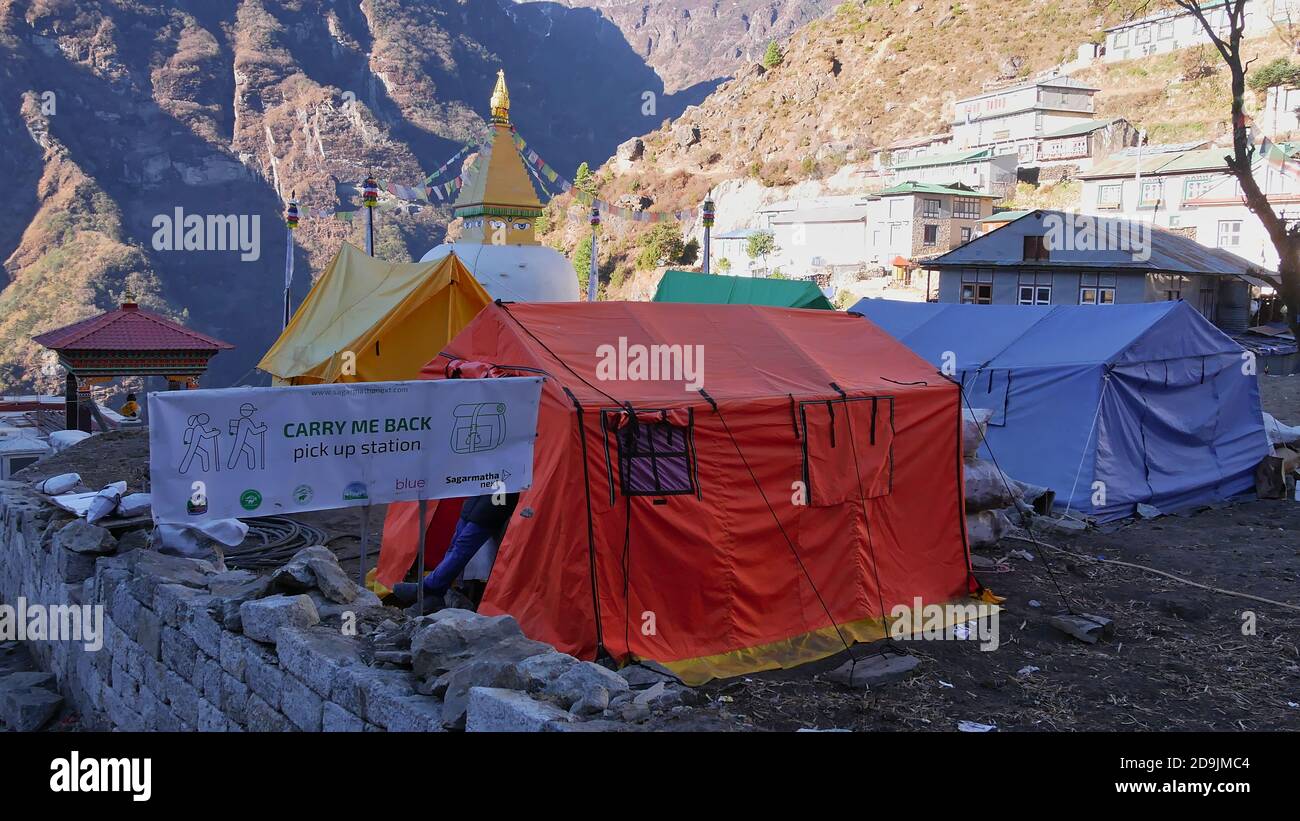 Namche Bazar, Nepal - 11/27/2019: 'Carry me back' project in Namche Bazar asking tourists to take small bags of garbage down to Lukla. Stock Photo