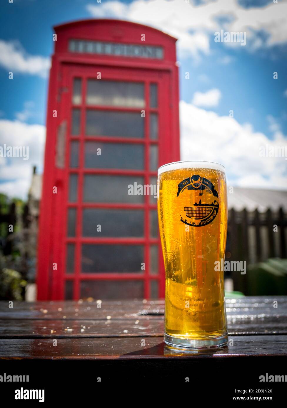 Pint of Punk IPA beer with phone box Stock Photo
