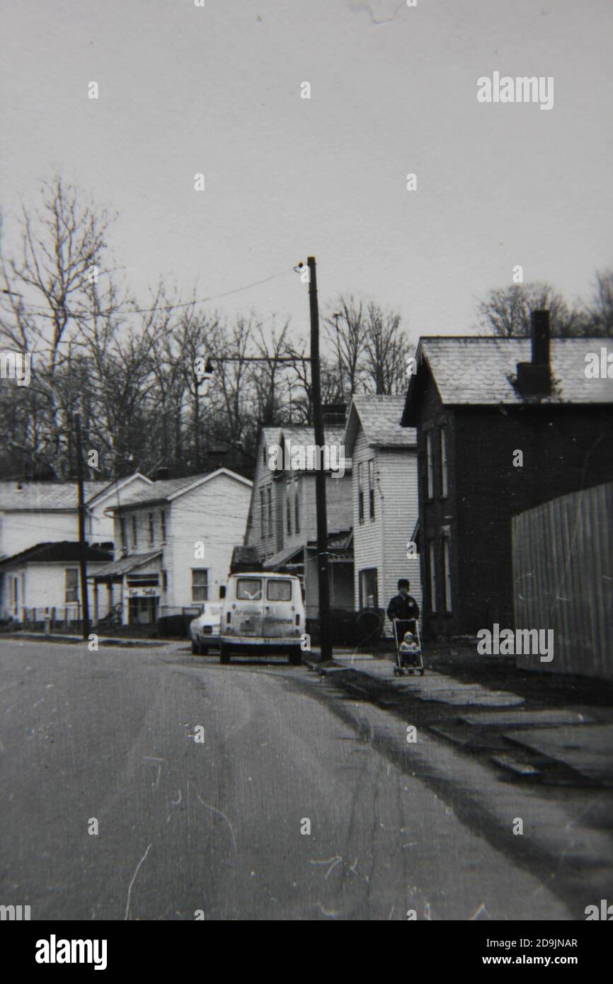 Fine 1970s vintage black and white photography of a casual street scene ...