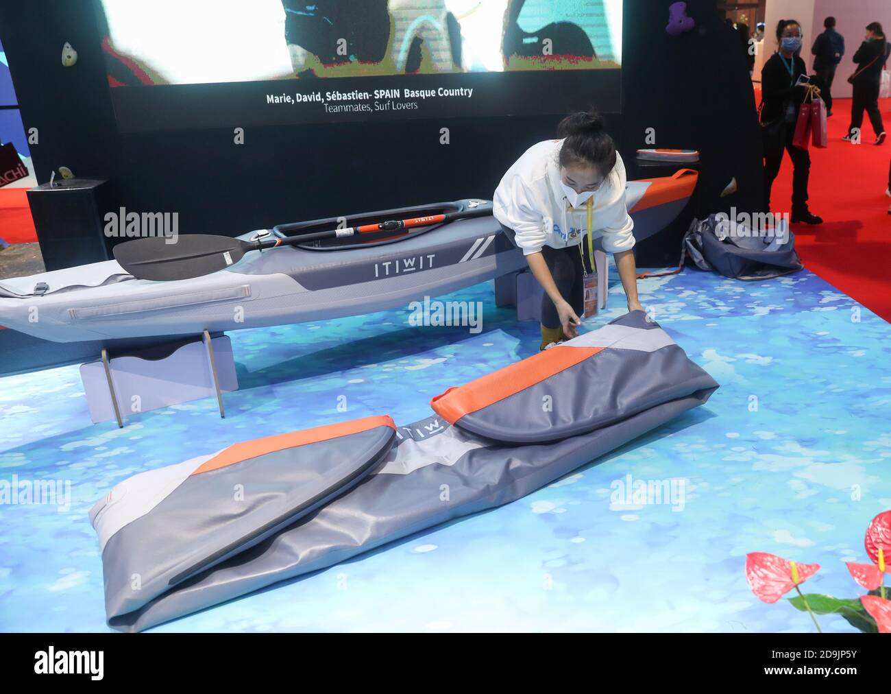 Shanghai, China. 6th Nov, 2020. A staff member demonstrates how to use a  foldable kayak at the booth of French sports retail giant Decathlon during  the third China International Import Expo (CIIE)